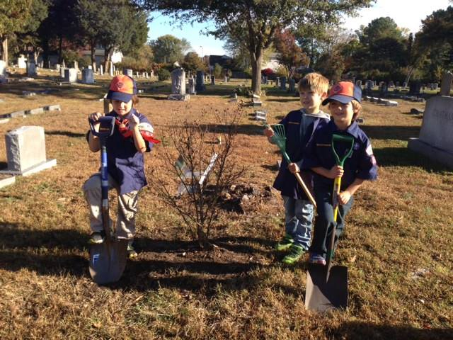 Young Boy Scouts planting at the Parsons Cemetery