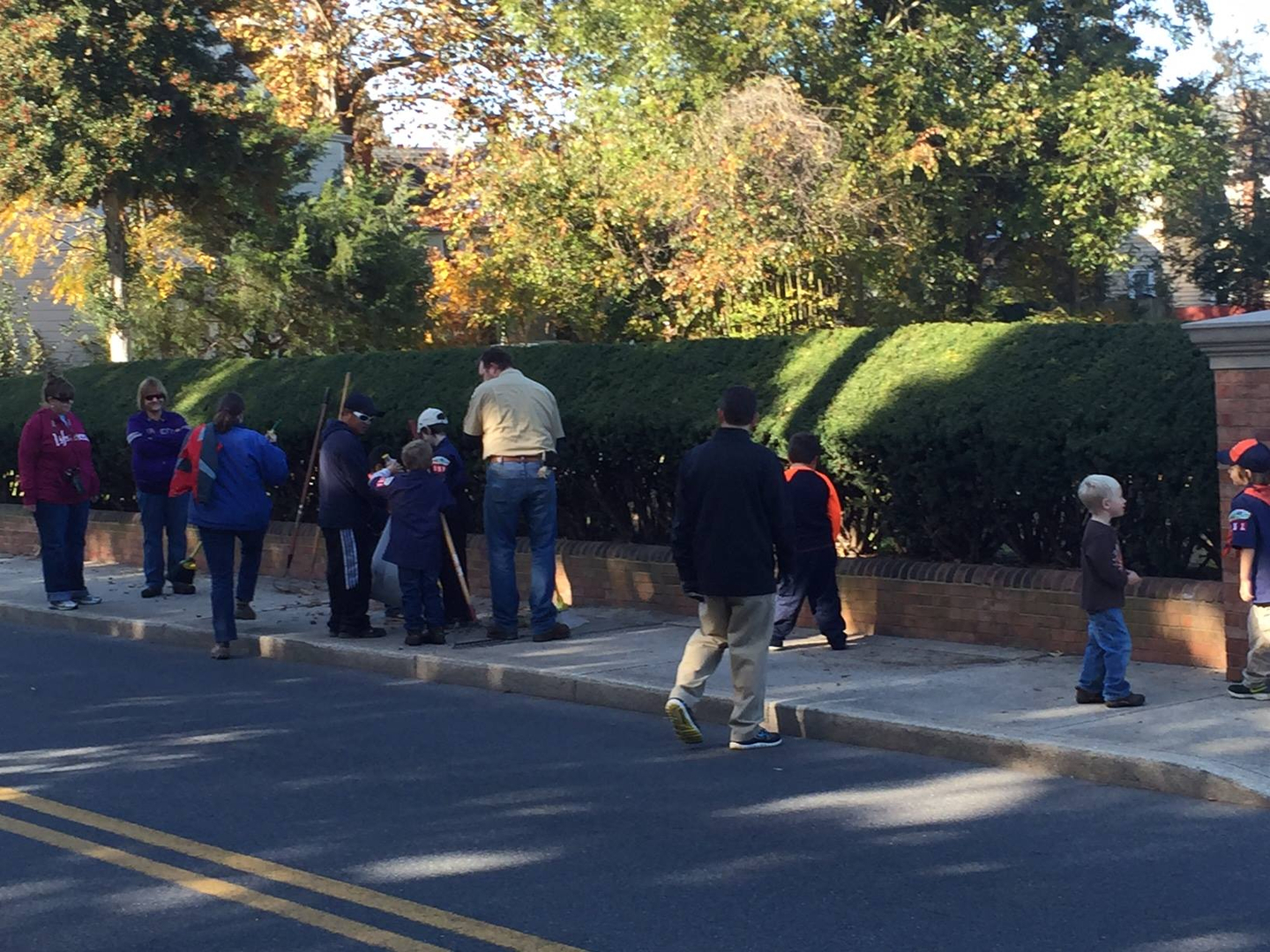 Group of boy scouts planting outside the Parsons Cemetery
