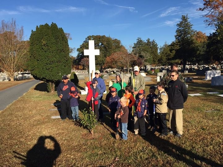 Group of kids planting at the Parsons Cemetery